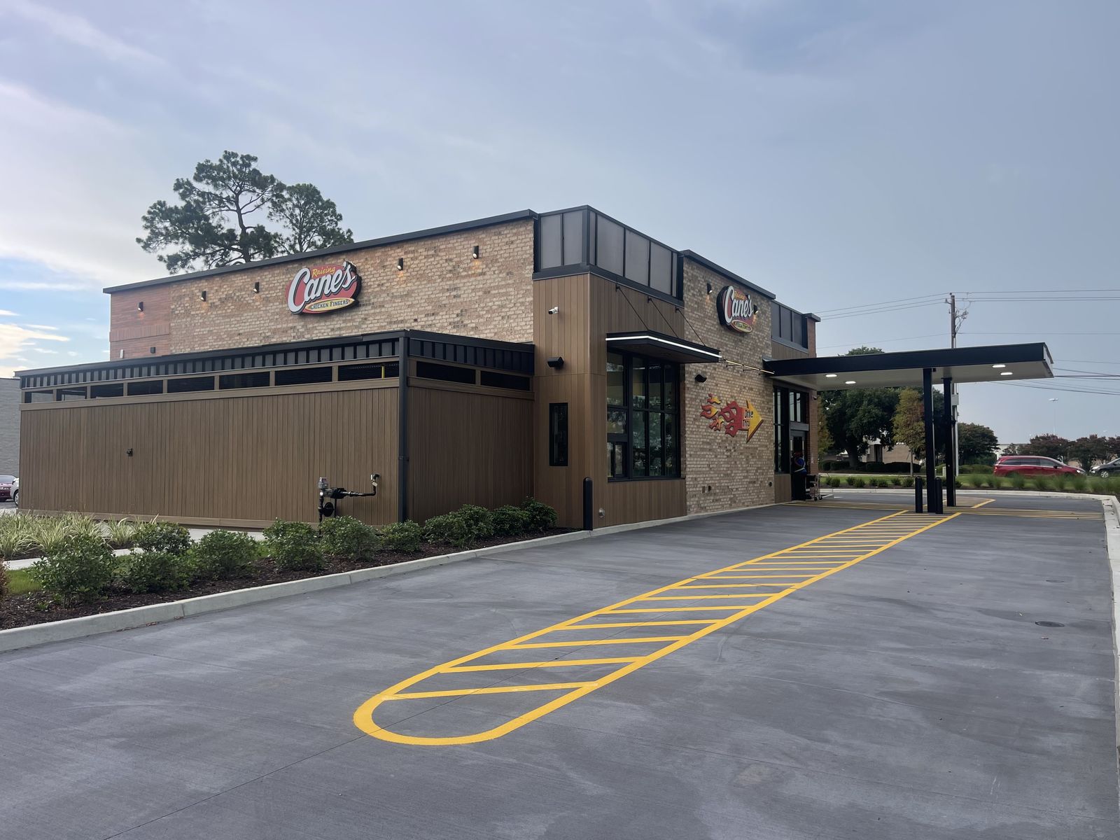 Quick-service restaurant drive-thru lane and canopy after post-construction cleaning