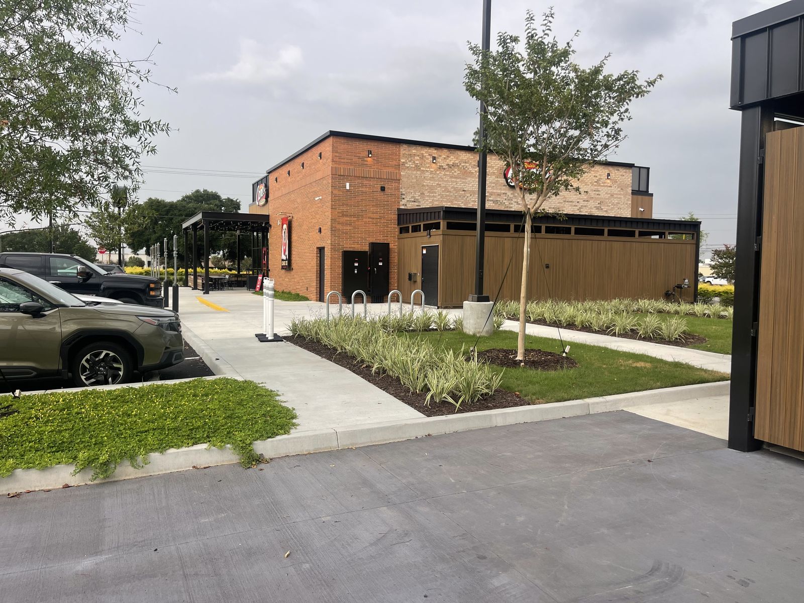 Quick-service restaurant dining patio and brick exterior after final clean